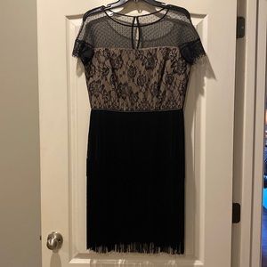 Beautiful black party dress with a fun fringed skirt.